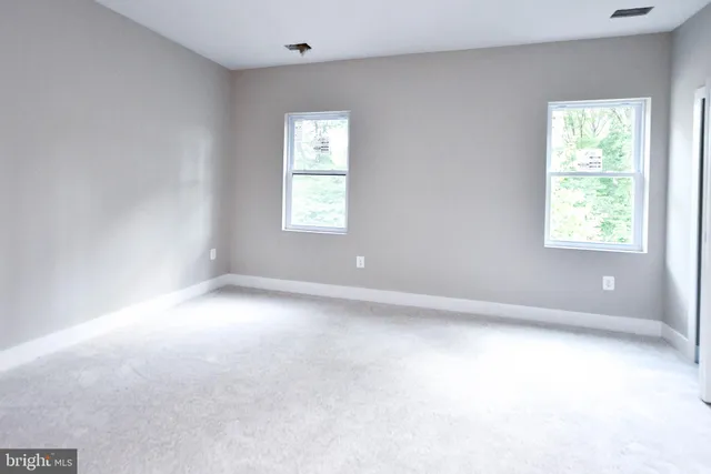 a bathroom with a shower and a window