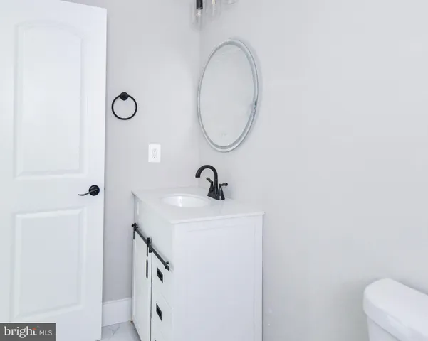 a front view of brick house with a yard