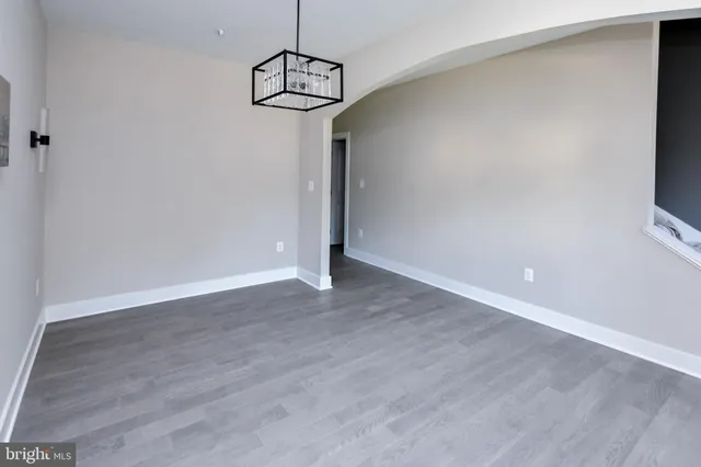 a bathroom with a bathtub sink mirror and toilet