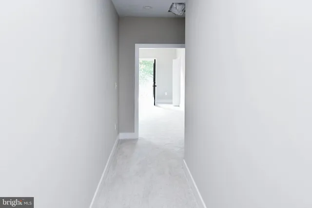 a view of a room that has a bench in it