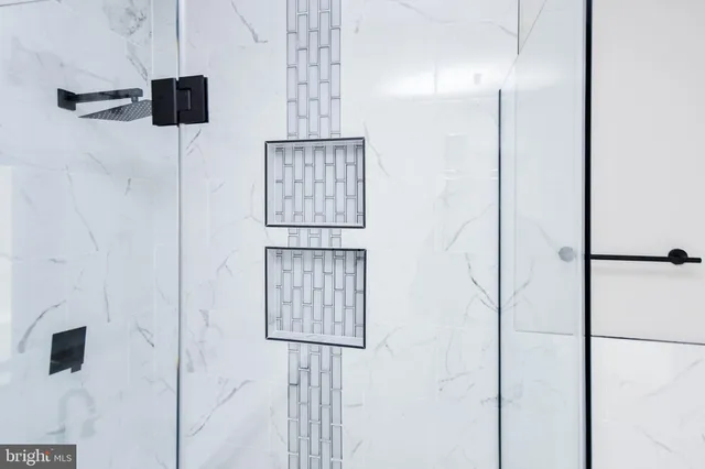 a view of a room with wooden floor and a window