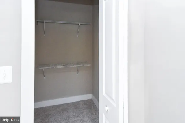 a view of a living room with wooden floor