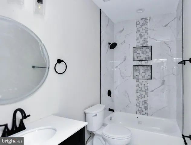 a bathroom with a sink and mirror