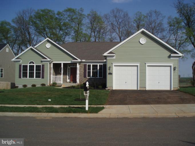 3 Elmer Derr Road Frederick, MD 21703 - Photo 13 of 30 a front view of a house with a yard and trees