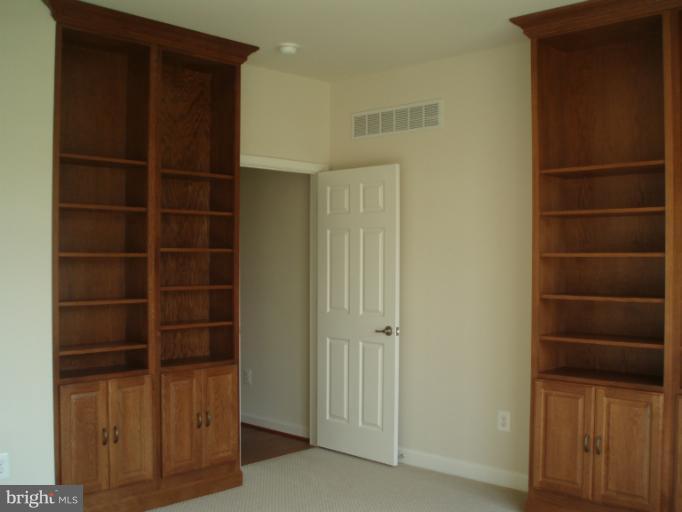 3 Elmer Derr Road Frederick, MD 21703 - Photo 16 of 30 a view of walk in closet with empty racks