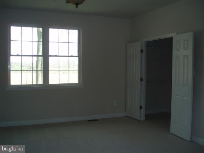 3 Elmer Derr Road Frederick, MD 21703 - Photo 17 of 30 an empty room with a window