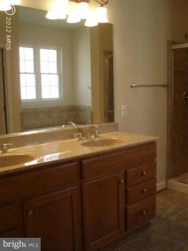 3 Elmer Derr Road Frederick, MD 21703 - Photo 19 of 30 a bathroom with a sink and two mirror