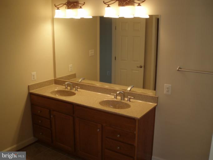 3 Elmer Derr Road Frederick, MD 21703 - Photo 22 of 30 a bathroom with a sink and a mirror
