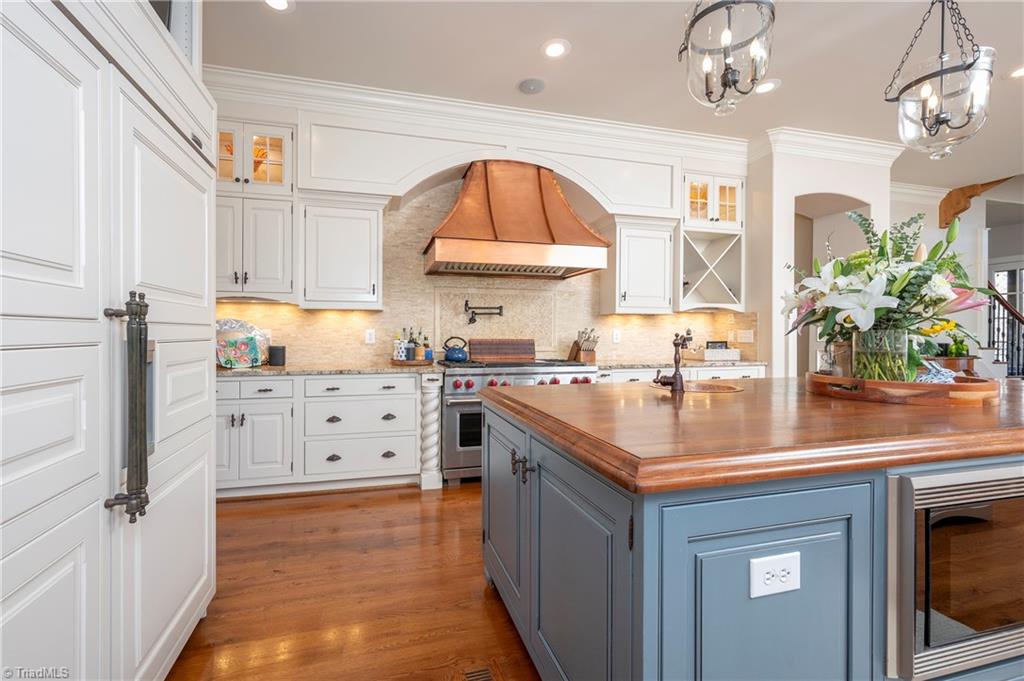 287 James Way Bermuda Run, NC 27006 - Photo 11 of 44 Wolf 48" duel fuel range with custom copper hood, SubZero 48" paneled fridge