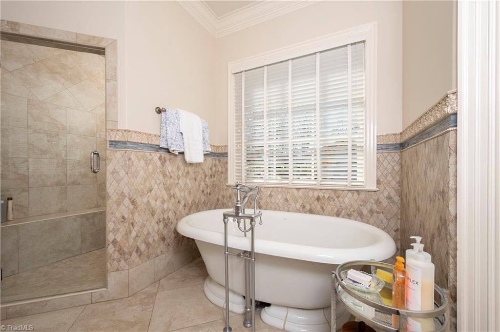 287 James Way Bermuda Run, NC 27006 - Photo 20 of 44 Spa like bath with cast iron soaking tub, custom tile shower