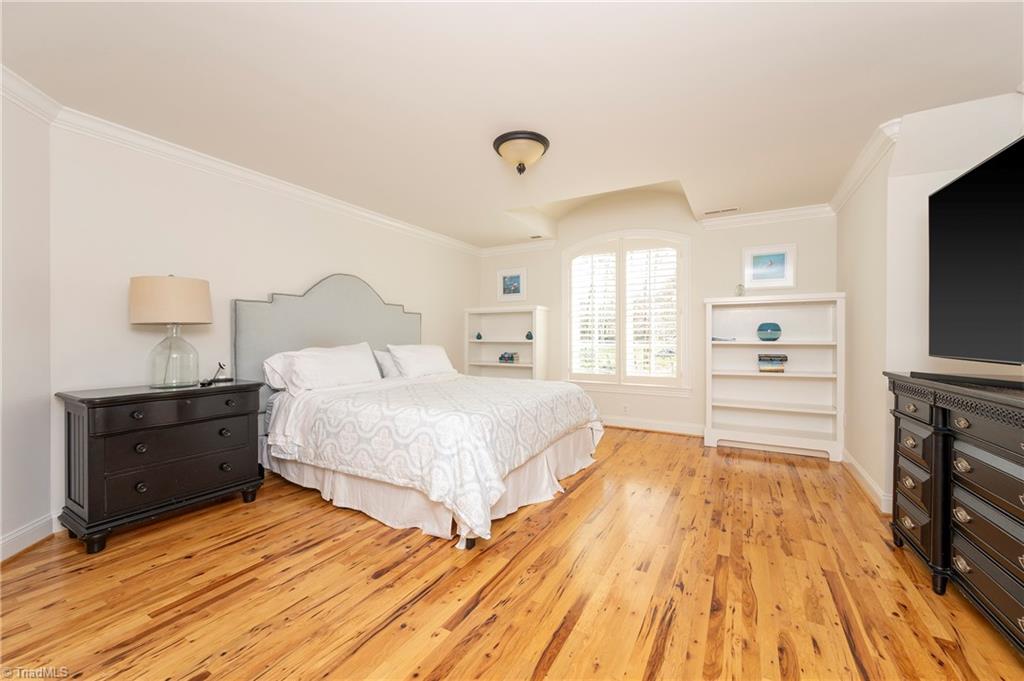 287 James Way Bermuda Run, NC 27006 - Photo 22 of 44 En suite bedroom 2 with built-ins and hickory flooring on the second floor