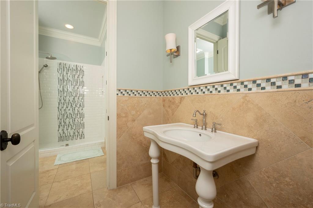 287 James Way Bermuda Run, NC 27006 - Photo 37 of 44 Custom tiled bath with pharmacy sink and shower