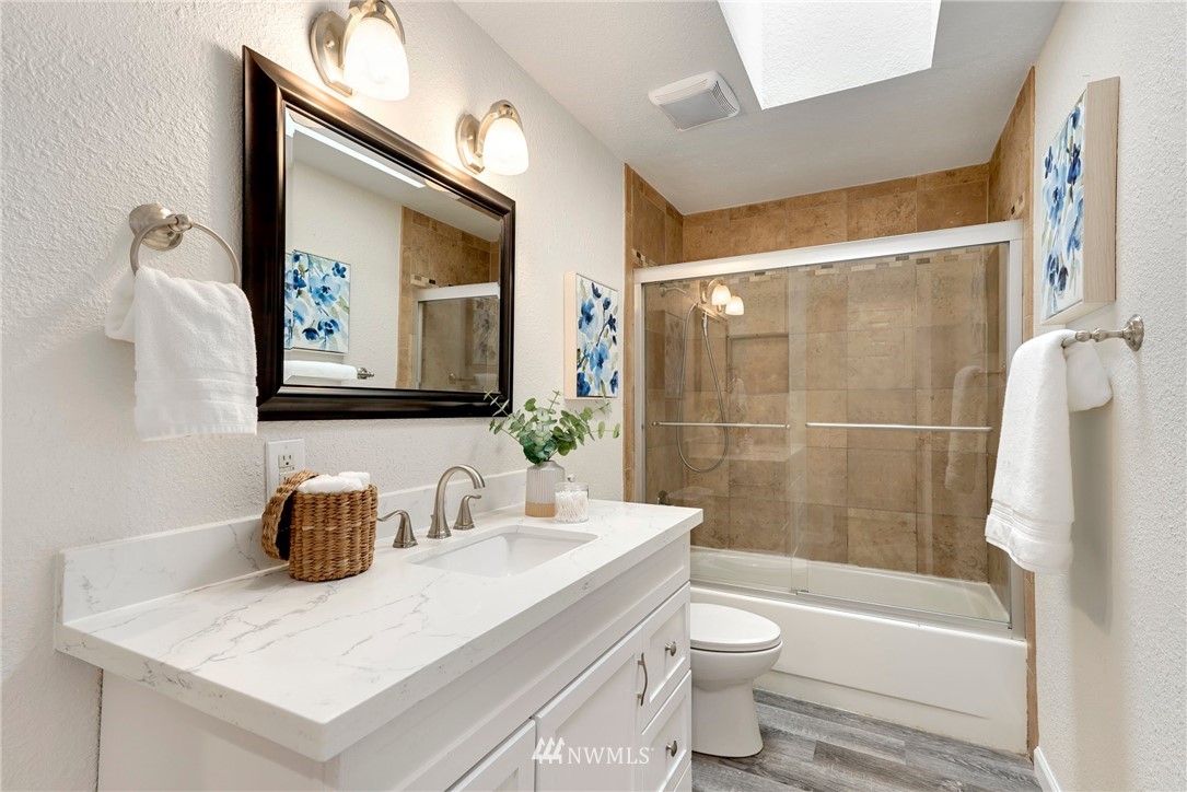 17307 18th Avenue Southeast Bothell, WA 98012 - Photo 14 of 40 a bathroom with a sink a toilet and shower