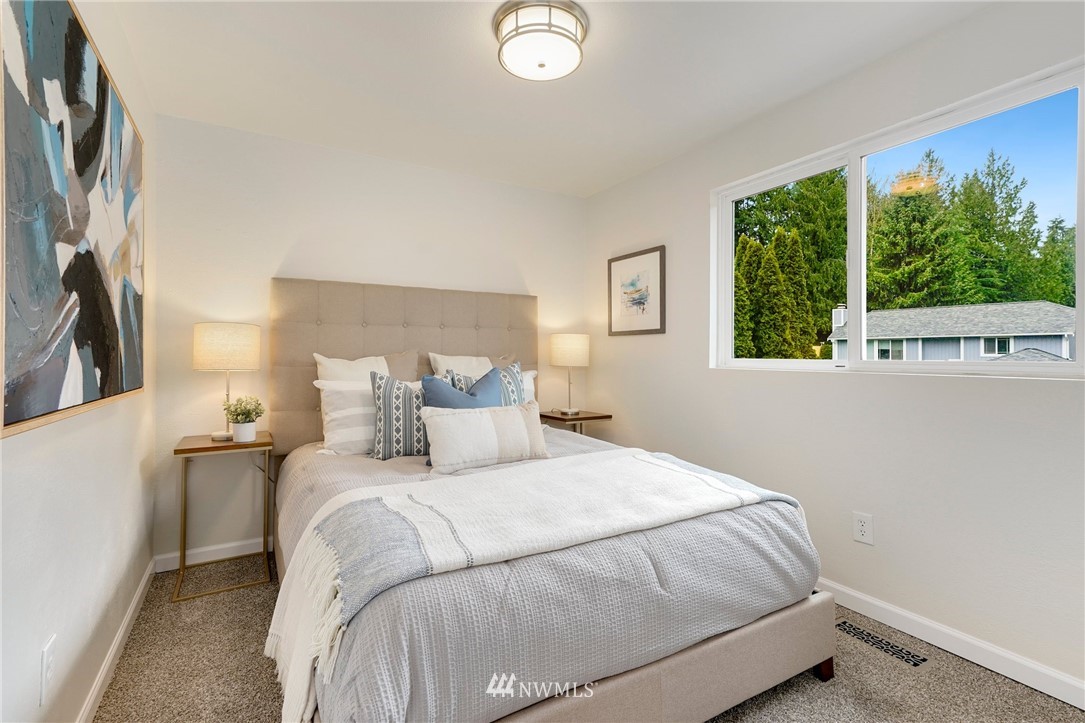 17307 18th Avenue Southeast Bothell, WA 98012 - Photo 15 of 40 a bedroom with a bed and a large window