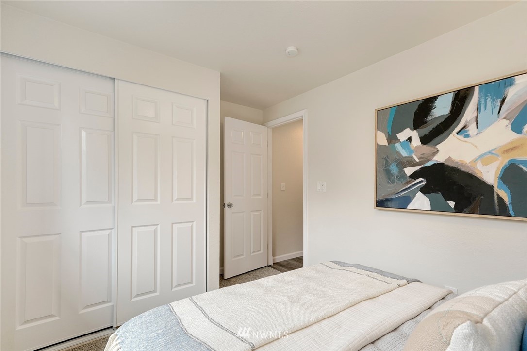 17307 18th Avenue Southeast Bothell, WA 98012 - Photo 16 of 40 a bedroom with a bed and a painting on the wall