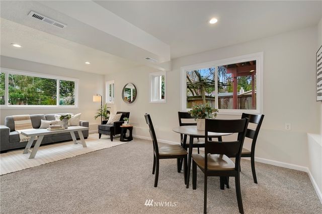 a view of a dining room with furniture window and outside view