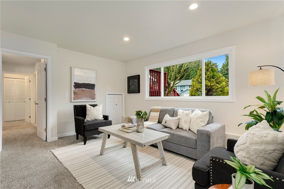 17307 18th Avenue Southeast Bothell, WA 98012 - Photo 23 of 40 a living room with furniture and a potted plant