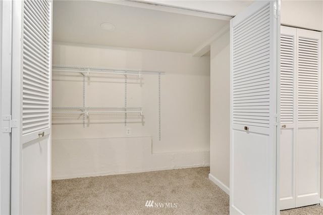 an empty room with shelves