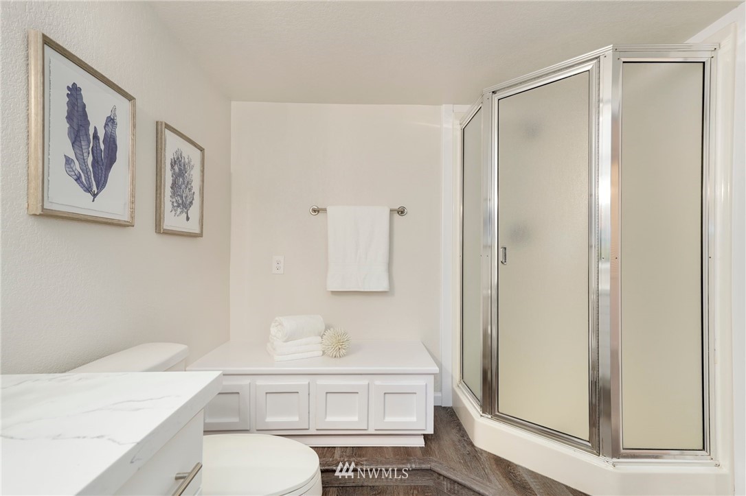 17307 18th Avenue Southeast Bothell, WA 98012 - Photo 26 of 40 a bathroom with a sink a toilet and shower