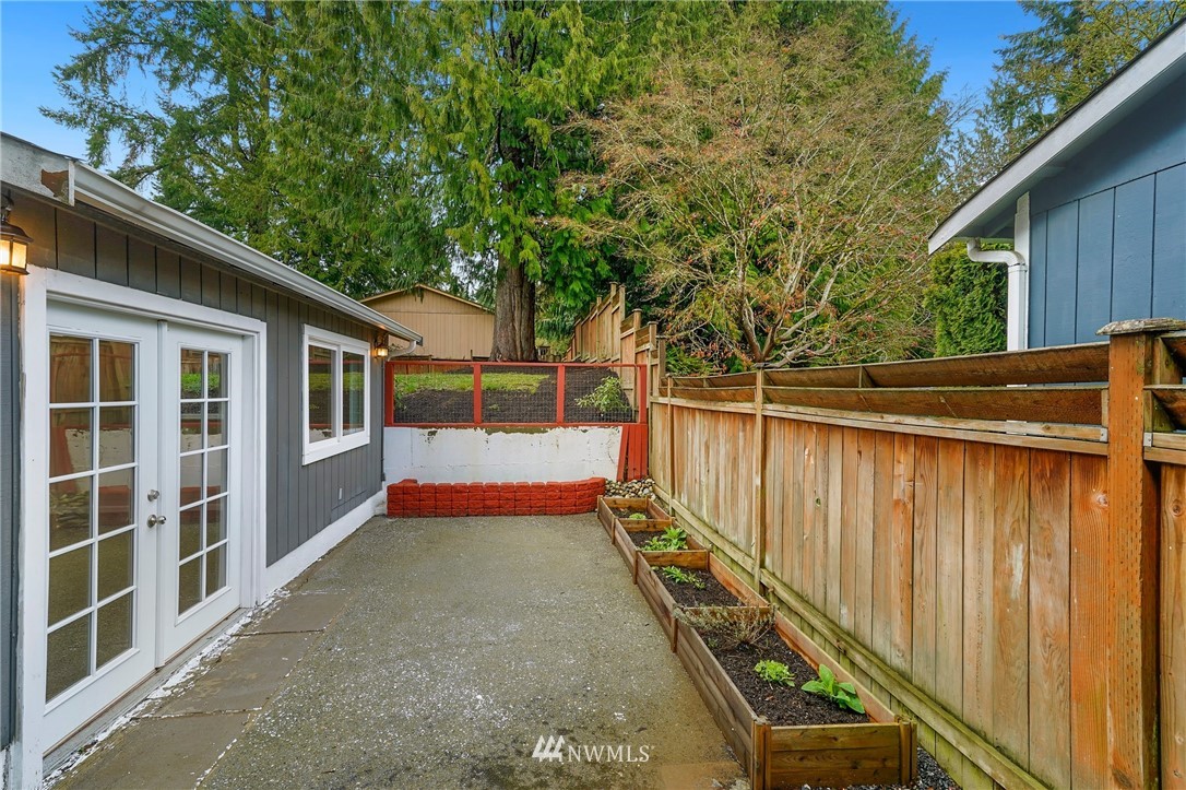 17307 18th Avenue Southeast Bothell, WA 98012 - Photo 30 of 40 a balcony with trees in front of it
