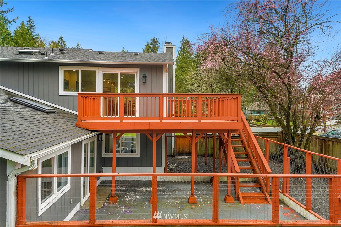 17307 18th Avenue Southeast Bothell, WA 98012 - Photo 34 of 40 a view of small house with large windows and a small yard