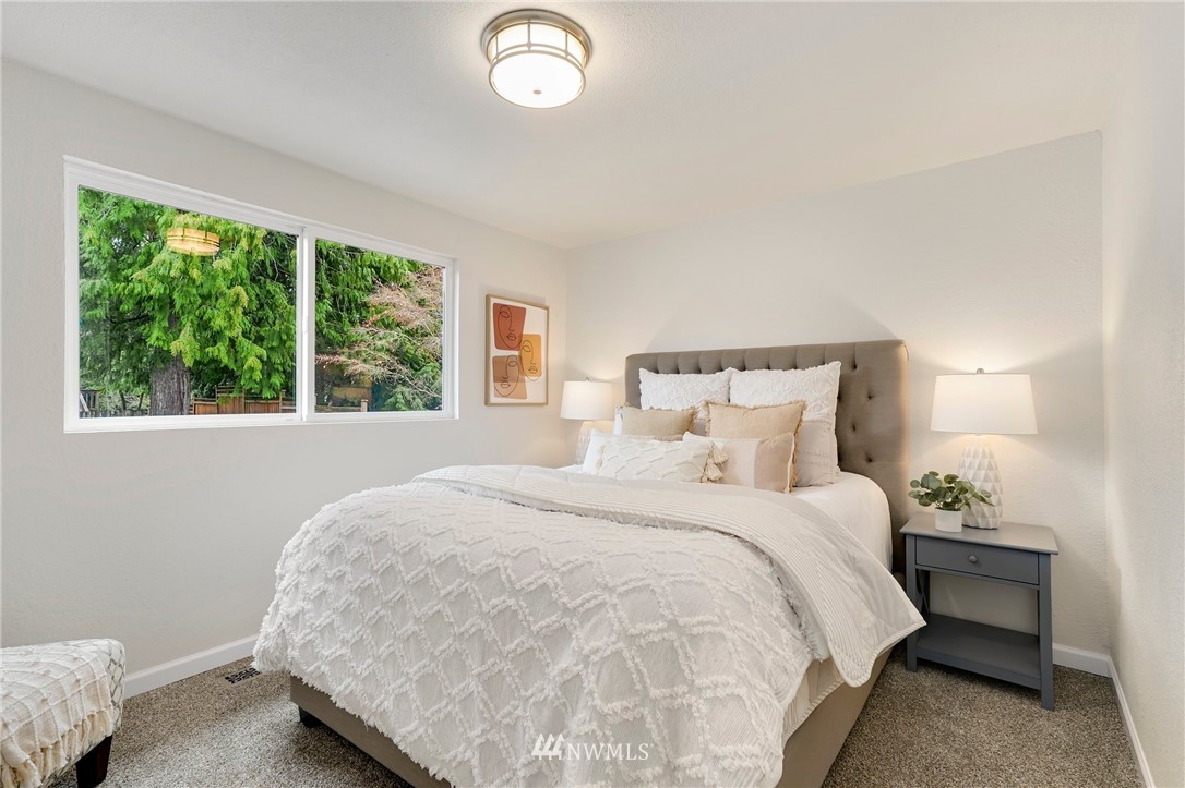 17307 18th Avenue Southeast Bothell, WA 98012 - Photo 10 of 40 a bedroom with a bed and a large window