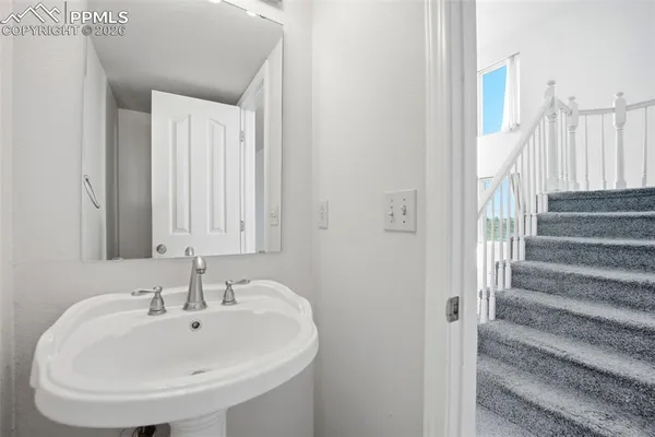 a view of a white house with windows