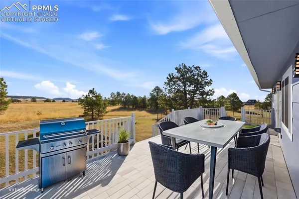 a view of wooden deck and city view