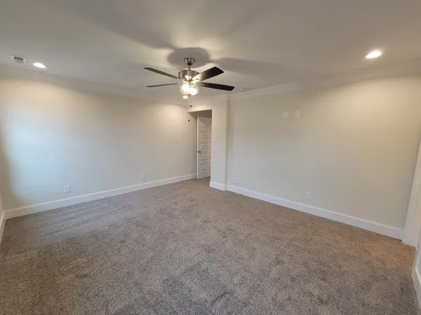 a view of a big room with carpet