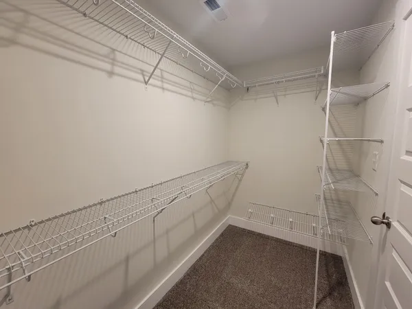a view of a room with racks on the wall