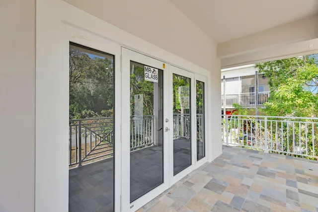 a view of a balcony with wooden floor