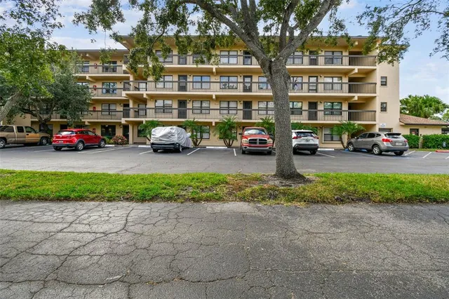 a view of a cars in front of a building