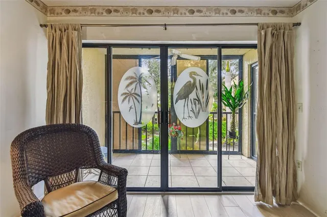 a view of a dining room with furniture and window