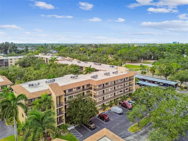a view of a park with swings and slides