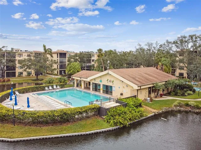 a sign board with a play ground in the back