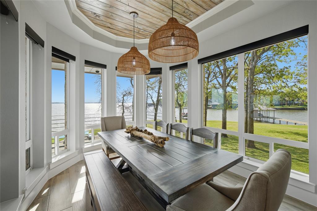 1617 Maple Drive Tool, TX 75143 - Photo 12 of 40 a view of a dining room with furniture large windows and wooden floor