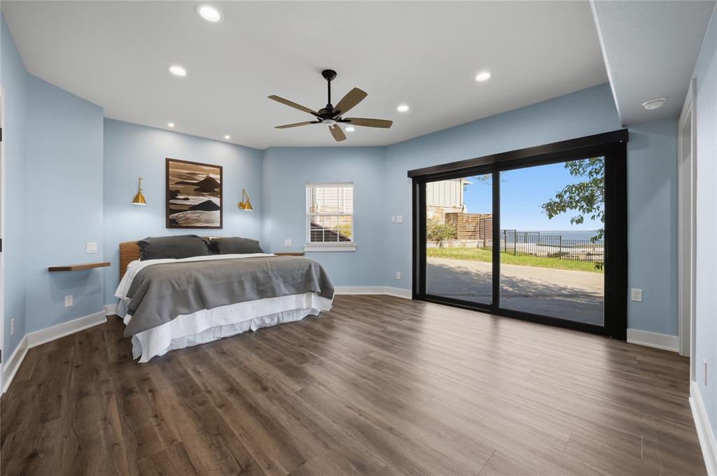 1617 Maple Drive Tool, TX 75143 - Photo 18 of 40 a bedroom with a large bed and a large window