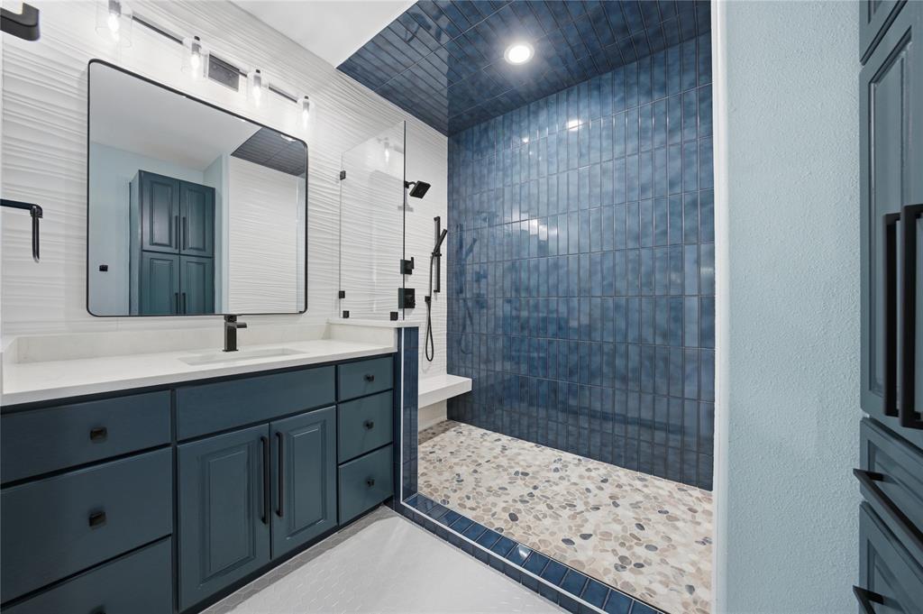 1617 Maple Drive Tool, TX 75143 - Photo 19 of 40 a bathroom with a sink and a mirror