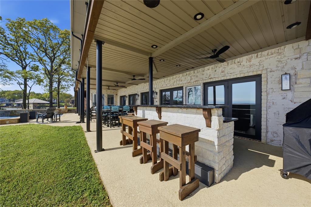 1617 Maple Drive Tool, TX 75143 - Photo 31 of 40 a view of a patio with dining table and chairs with a garden
