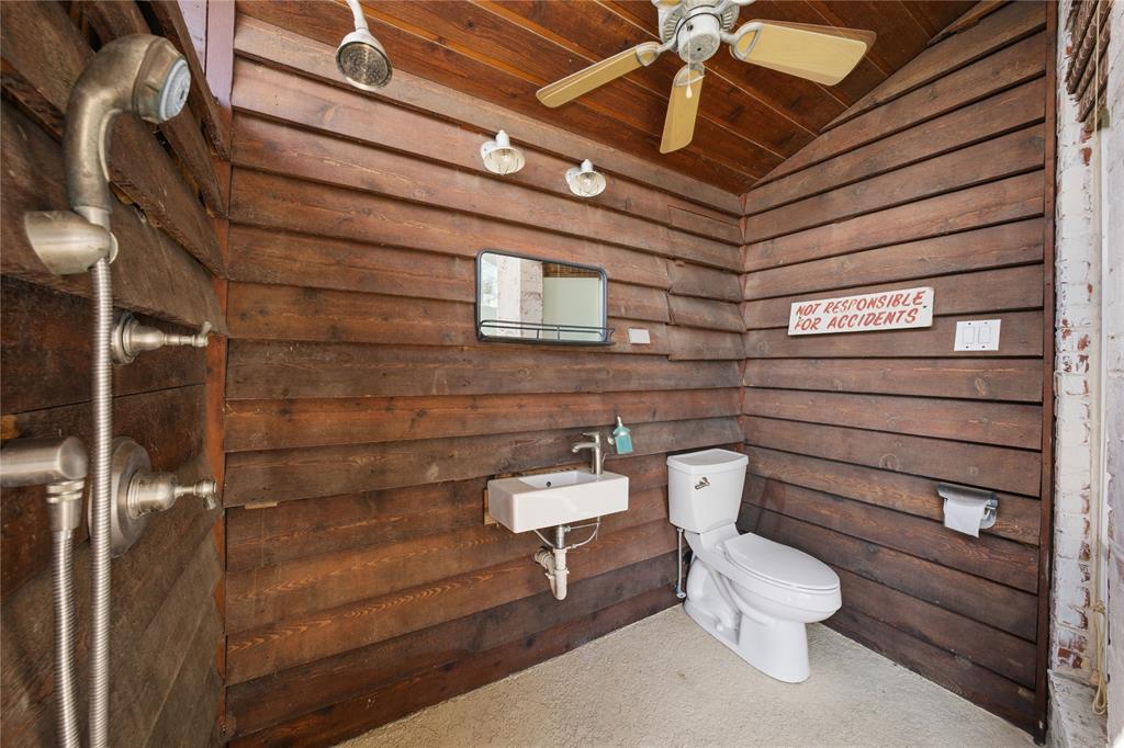1617 Maple Drive Tool, TX 75143 - Photo 35 of 40 a bathroom with a toilet and a shower