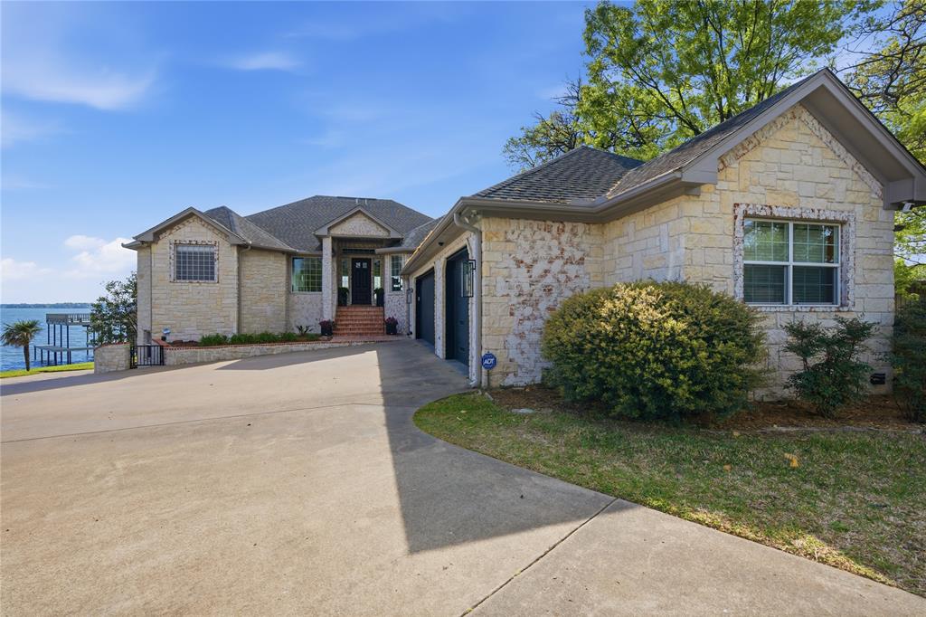 1617 Maple Drive Tool, TX 75143 - Photo 40 of 40 a front view of a house with a yard and garage