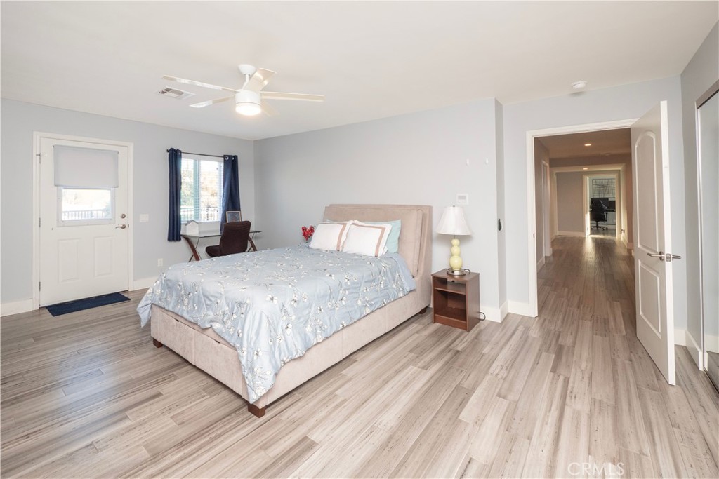1310 Coronet Drive Riverside, CA 92506 - Photo 32 of 59 End of hall bedroom w/ door to balcony
