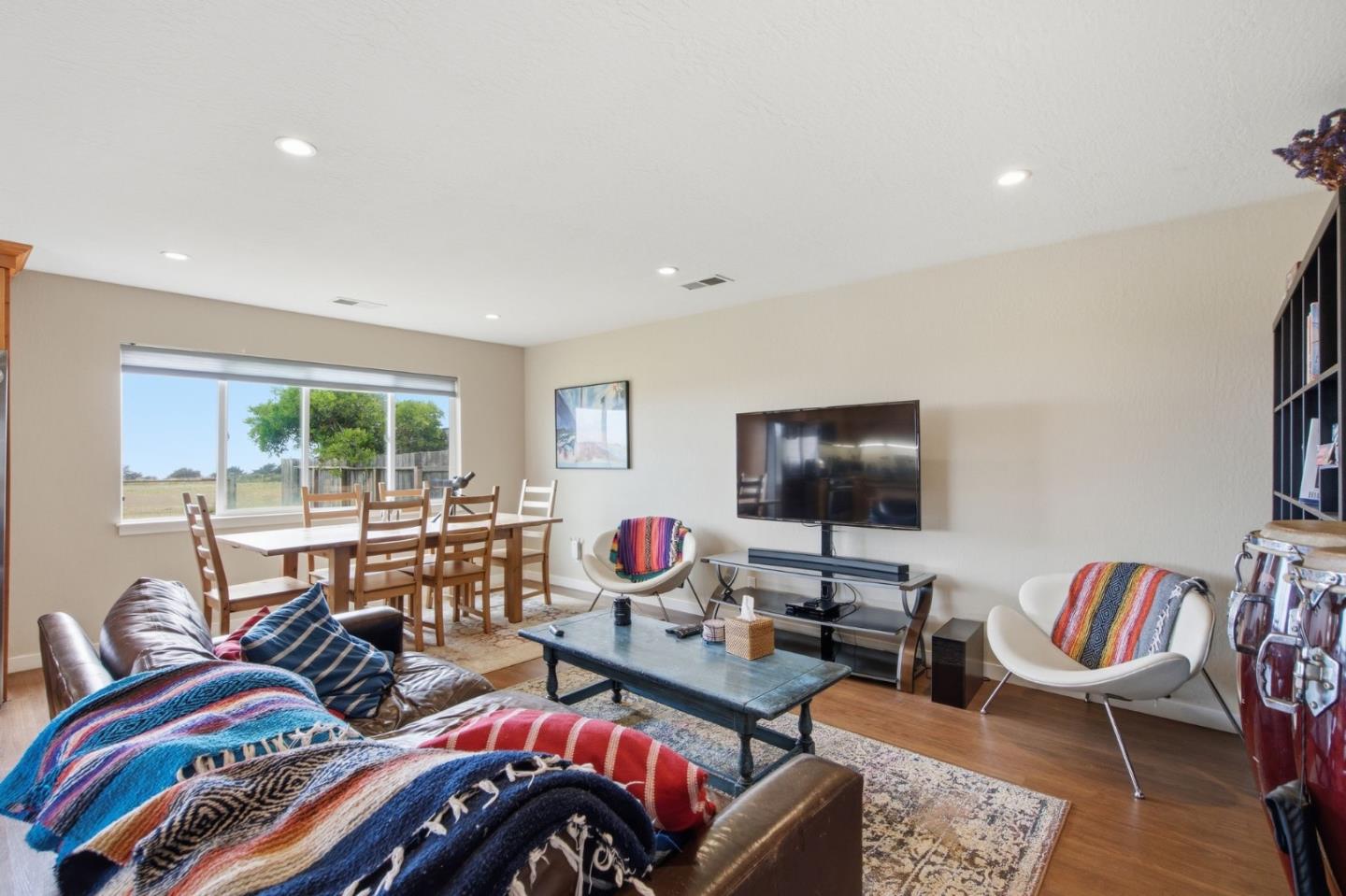 1263 Reservoir Road Pescadero, CA 94060 - Photo 54 of 66 a living room with furniture and a flat screen tv