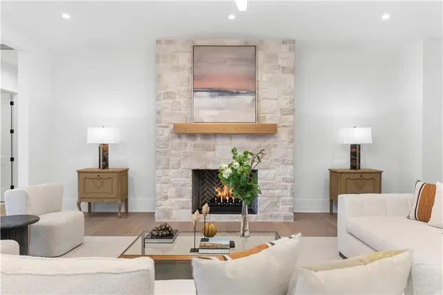 a spacious bathroom with a granite countertop sink and a large mirror