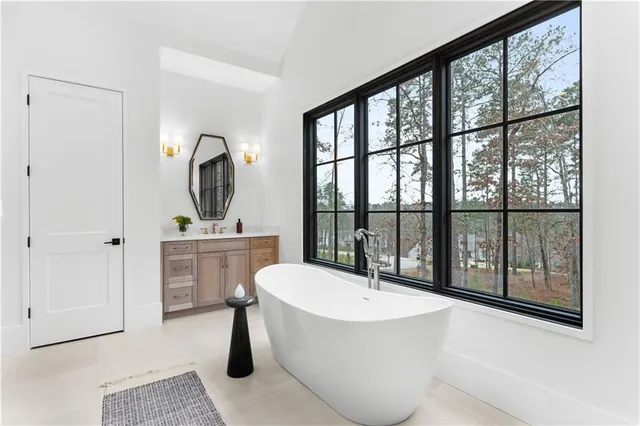 a view of cabinets and utility room with closet
