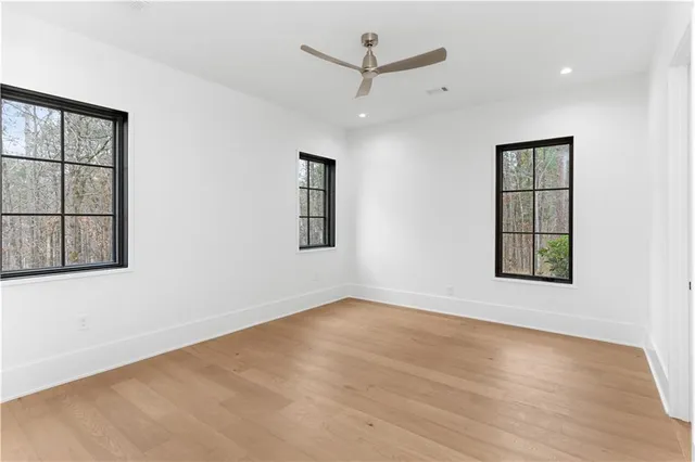 an aerial view of residential houses with outdoor space and lake view
