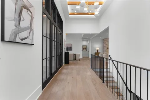 a spacious bathroom with a granite countertop sink and a large mirror