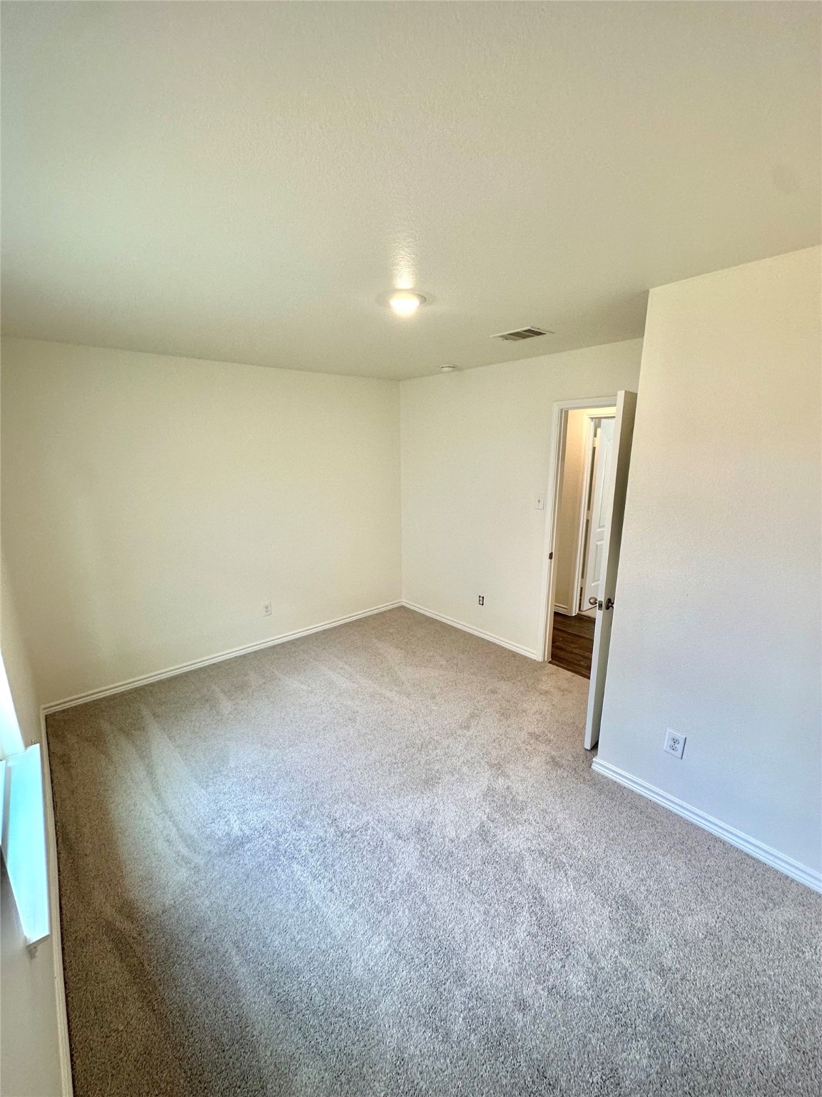 11203 Hall Ridge Court Houston, TX 77075 - Photo 17 of 21 an empty room with a natural light