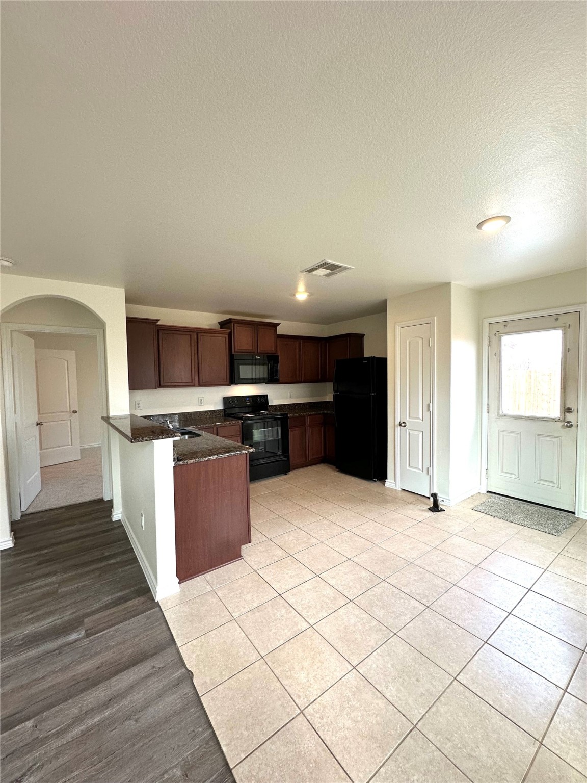 11203 Hall Ridge Court Houston, TX 77075 - Photo 5 of 21 a large kitchen with stainless steel appliances granite countertop a refrigerator and a stove