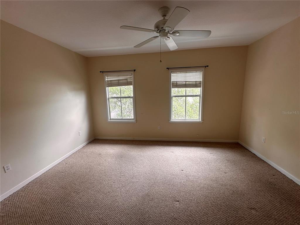 709 Bloom Street, Unit 240 Celebration, FL 34747 - Photo 8 of 17 a view of an empty room with a window